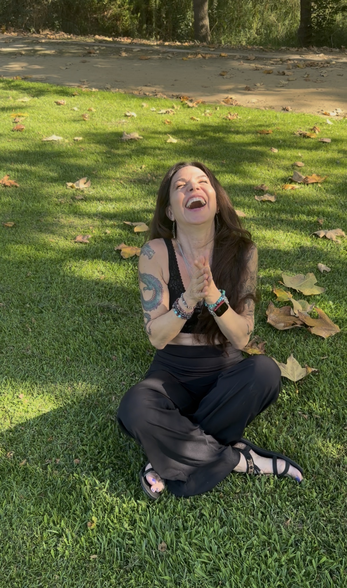 Bright Smiling Woman Meditating in Nature